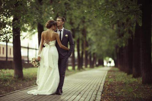 Bride in a white dress at a wedding is beautifully solemn